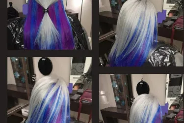An image of a woman who hair has been dyed white and vibrant purple.